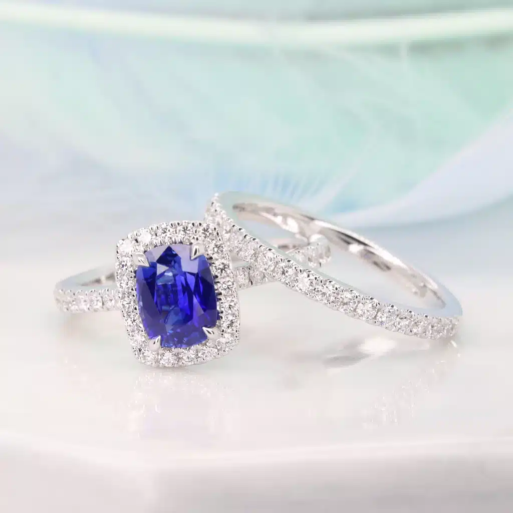 unheated blue sapphire in cornflower blue ring with diamond bands