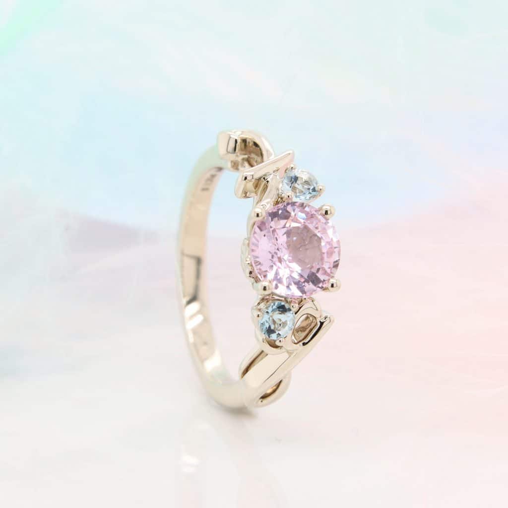 personalised engagement ring with pink sapphire with Personalised design and character on your ring.