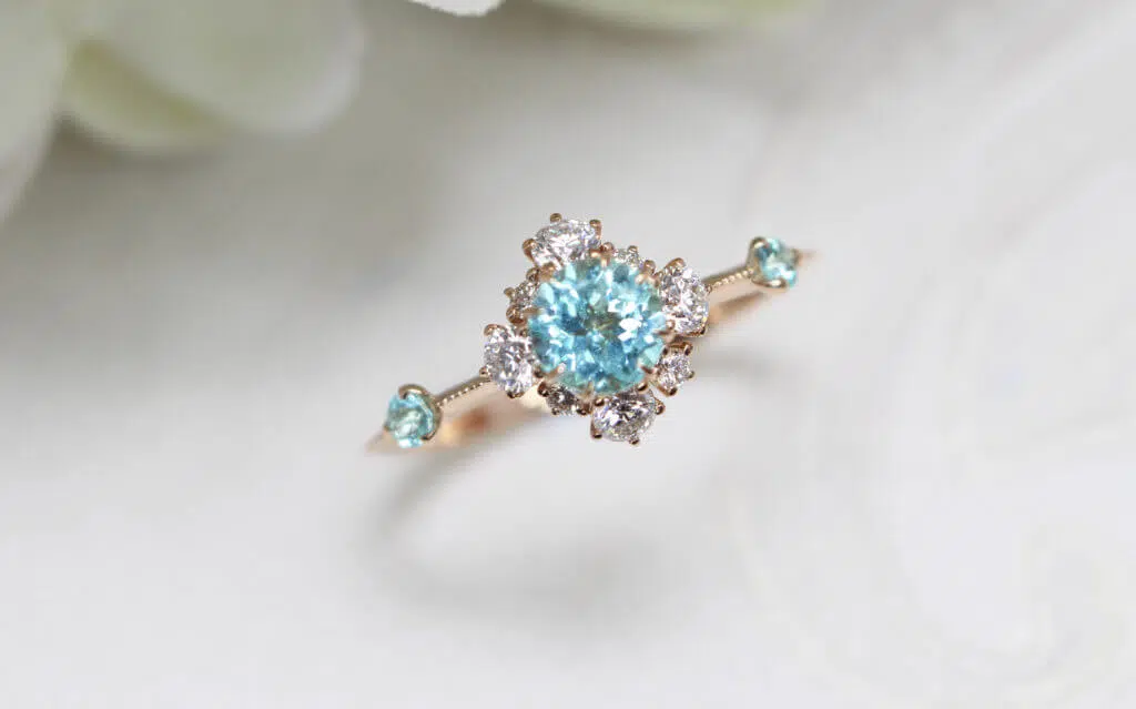 Vintage Style Paraiba Tourmaline Engagement Ring in Rose Gold with Spaced Diamond Halo - GIOIA Fine Jewellery Singapore