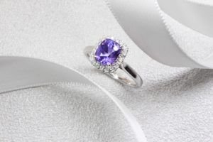 Violet Sapphire with halo round brilliant diamonds, coloured gemstone in violet and purplish shade. Unique customised sapphire ring from husband to wife | Local Singapore Jeweller in Customised Jewellery, design from sketch design jeweller - Private Jeweller