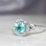 Customised electric blue or mint green Paraiba Tourmaline Proposal Ring - custom made to different classic yet stylish pieces of wedding jewellery | Local Singapore Jeweller in customised jewellery with paraiba tourmaline coloured gemstone