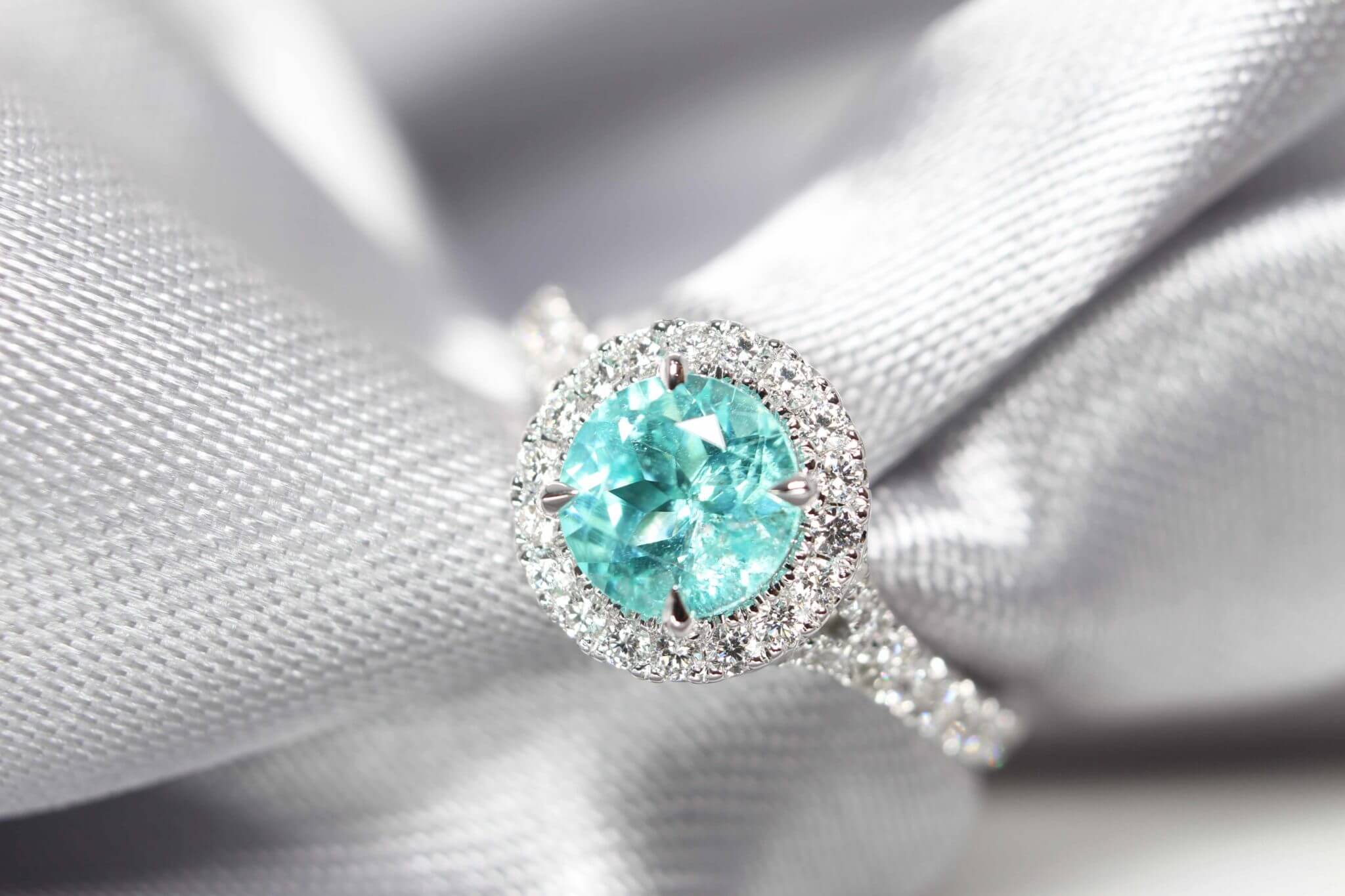 Customised electric blue or mint green Paraiba Tourmaline Proposal Ring - custom made to different classic yet stylish pieces of wedding jewellery | Local Singapore Jeweller in customised jewellery with paraiba tourmaline coloured gemstone