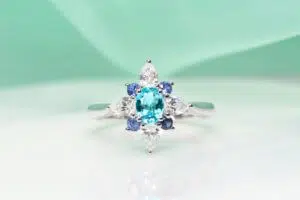 Brazil Paraiba Tourmaline Ring customised and design with pear shaped diamond and round brilliance blue sapphire inspired by a flora design - Customised Engagement Ring with local Singapore bespoke customised jeweller, with Mozambique and Brazil Paraiba