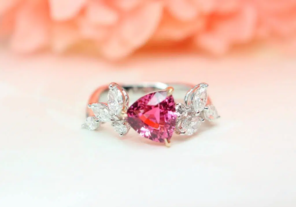 Bright Pink Mahenge Spinel Gemstone in trilliant cut shape and marquise shaped diamond which give a distinctive design look - Customised Jewellery in Singapore, custom made to the wear with unique jewellery design.