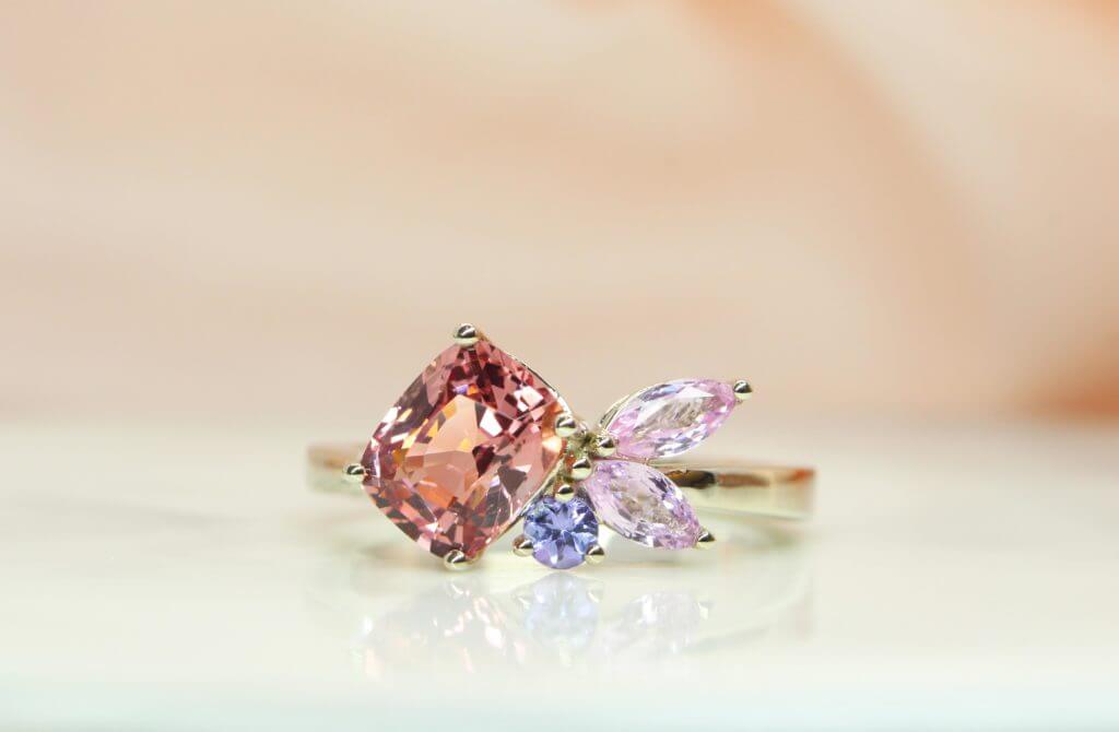 Cluster Spinel Ring orange-pink shade instead of solitaire for their wedding engagement in Champagne gold | Singapore Customised Jeweller in Wedding Jewelry.