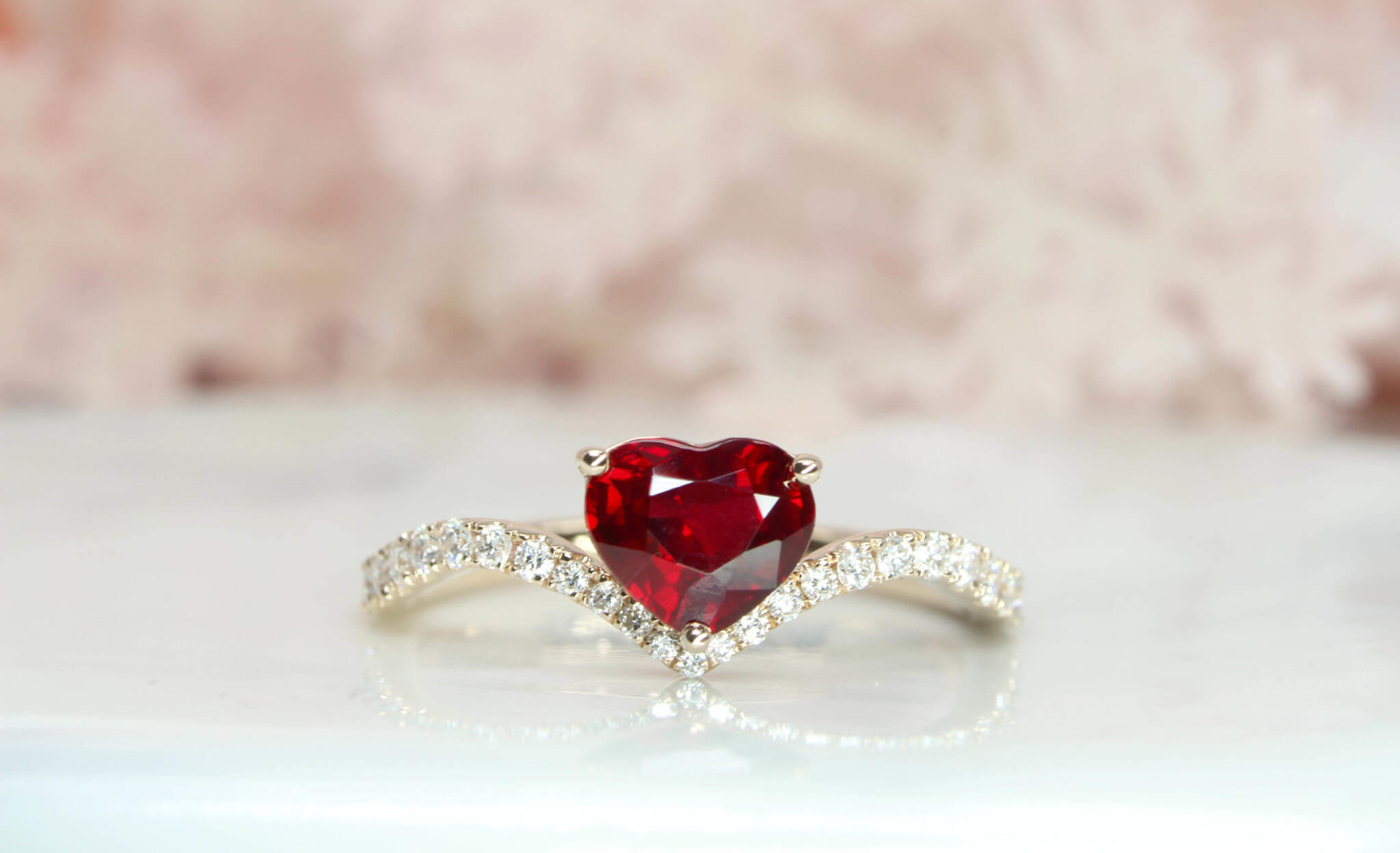 Heartshape Ruby Pigeonblood skilfully cut in well symmetry and polish to give an exceptional brilliance in the ruby. Crafted from sketch to a unique wedding engagement ruby ring | Customised Engagement by local Singapore customised jewellery in wedding jewellery.