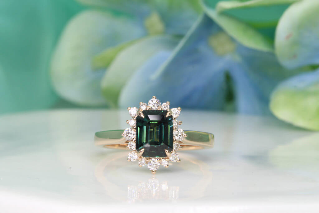 Teal Sapphire Engagement ring customised with alternate sizes diamond, Starburst design in Rose gold bands | Exquisite Customised Engagement Ring Teal Sapphire.