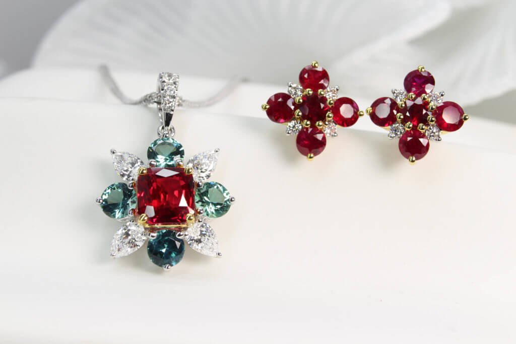 40th anniversary ruby jewellery set: starburst pendant, ring and cluster earrings in yellow gold, GIOIA bespoke Singapore