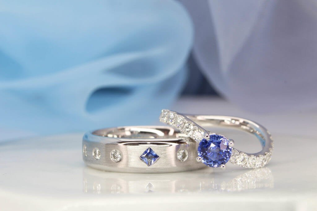 Unheated blue sapphire anniversary ring in a full eternity band with a twist detail, GIOIA bespoke Singapore