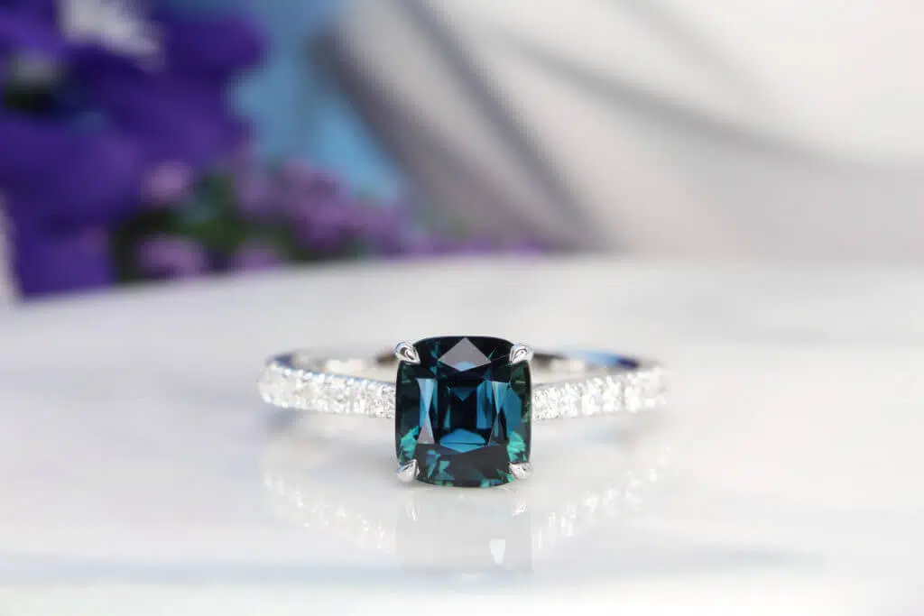 Teal Sapphire Ring Heirloom Jewellery Modern Heirloom Jewellery customised with natural gemstone is an object of legacy. Featuring a royal blue and teal sapphire customised ring, custom made for both the wearer daughters. It could be anything from an antique brooch or an art deco ring that has been held by the family for decades. Singapore Local Jewellery in Customised Jewellery