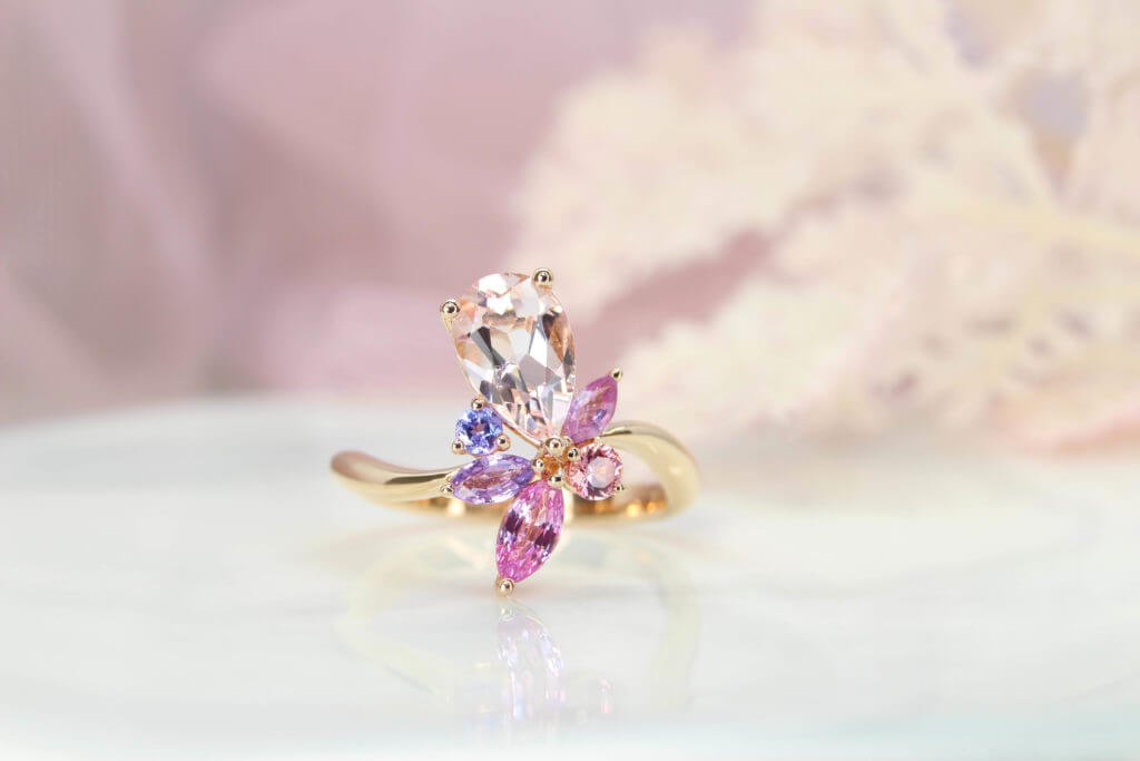 Floral cluster morganite engagement ring detail showing the mixed gemstone setting