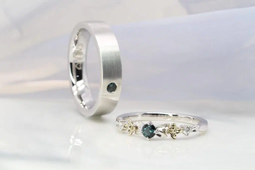 wedding bands customised to flora design with teal spinel