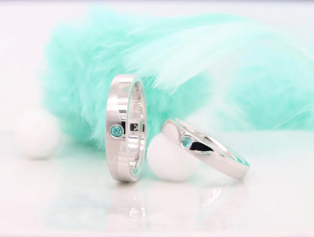 Custom platinum wedding bands set with Brazilian Paraiba Tourmaline — GIOIA Fine Jewellery Singapore
