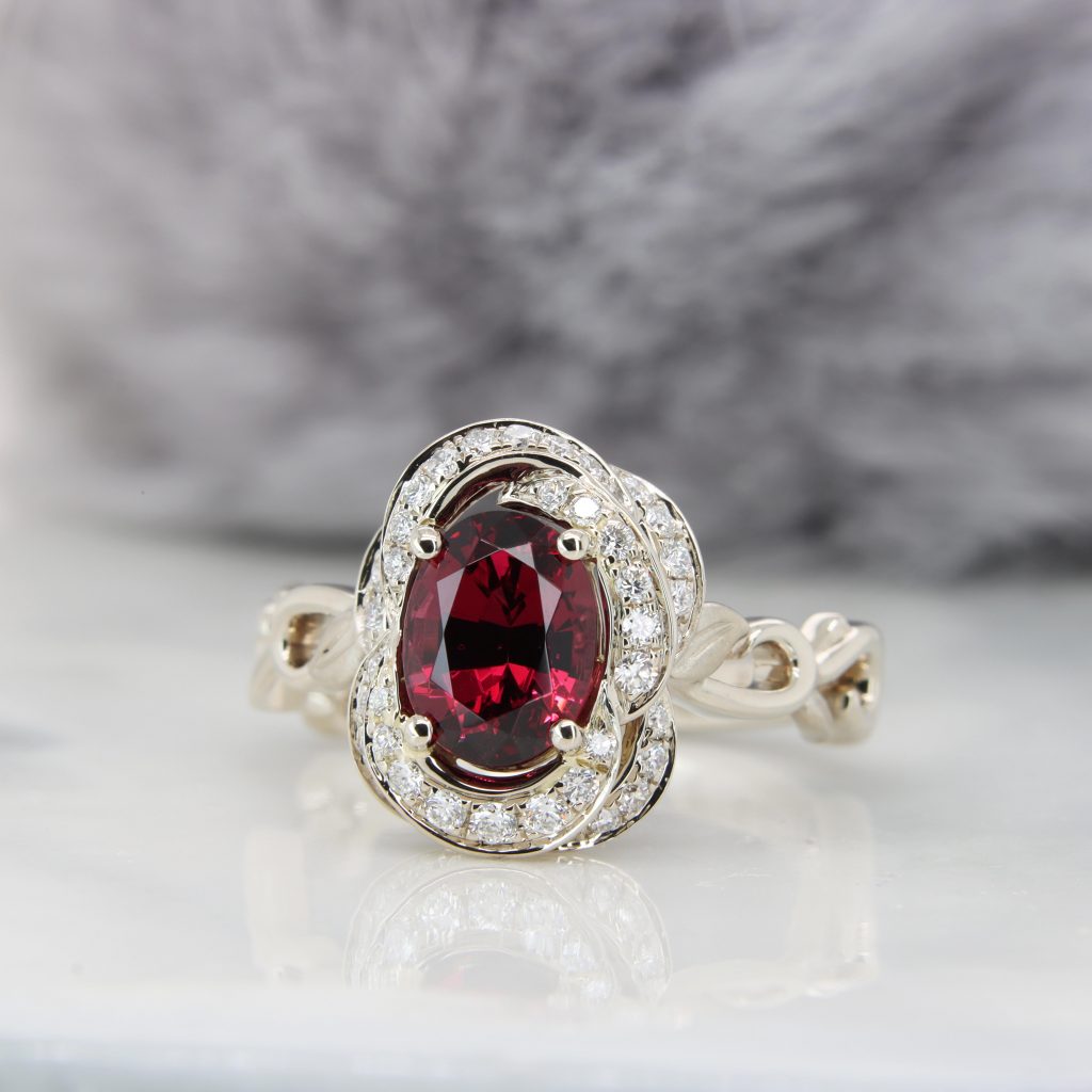 Floral Ring with garnet gemstone in champagne gold and diamond engagement ring in Singapore