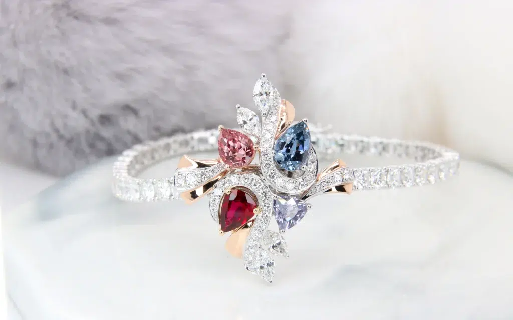 Family birthstone floral bracelet that detaches into a pendant, set with padparadscha sapphire and spinel, GIOIA