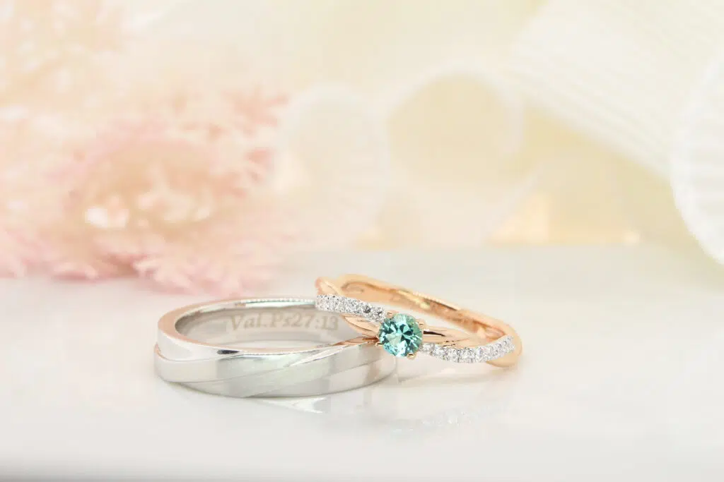 Customised-Wedding-Bands-with-Twisted-Diamond-bands-and-Bluish-Green-Tourmaline Customised Wedding Bands with Twisted Diamond Ring