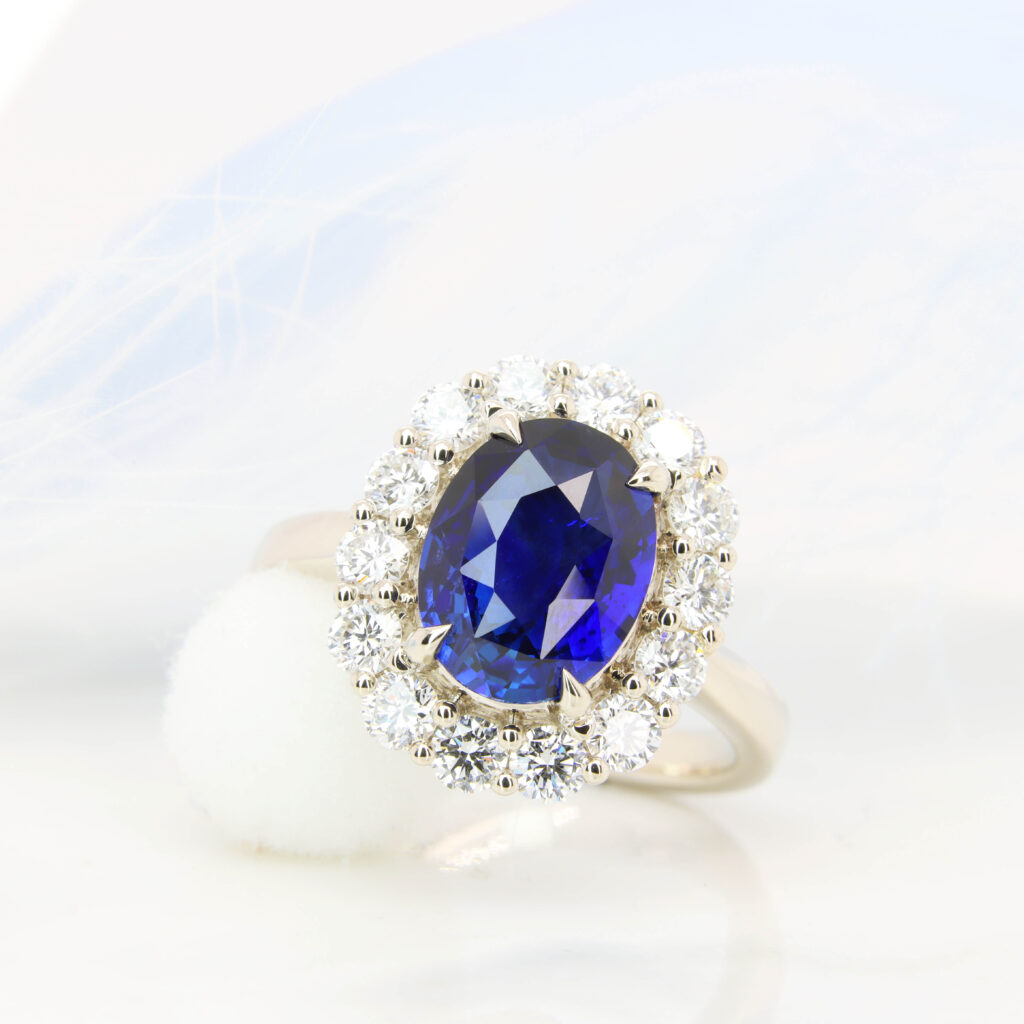 Royal Blue Sapphire Halo Diamond Custom Engagement Ring with surrounding diamond in champagne gold jewellery 