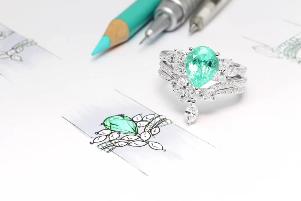 GIOIA Fine Jewellery 1 Paraiba Tourmaline Pear with Marquise Tiara Diamond Ring with Stackable Fine Jewellery Diamond Band Design High Jewelry GIOIA Fine Jewellery Best Gemstone Bespoke Jeweller in Singapore GIOIA Fine Jewellery Boutique Custom Jeweller in Singapore