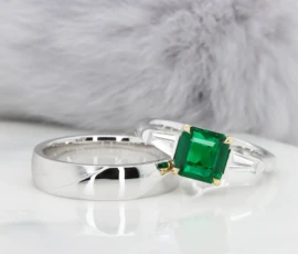 Emerald Engagement Ring with side tapered baguette Diamond fine jewellery design.