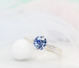 Round Brilliant Blue Sapphire with Twisted Diamond Ring Round Blue Sapphire with twisted diamond ring in champagne gold eye colour gemstone