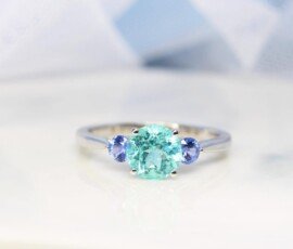 Engagement Ring with Paraiba Tourmaline customised with round blue tanzanite gemstone in 750 white gold band, unique customised engagement ring without diamond but customised with coloured gemstone for one of a kind design Local Singapore Jeweller in customised engagement ring with paraiba tourmaline gemstone.