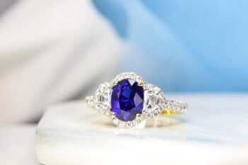 Royal Blue Sapphire with halfmoon and halo diamond ring