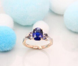Featuring a vivid blue sapphire gem with cluster blue spinel and marquise shaped diamond design. Exceptional Sapphire engagement ring customised unique design.