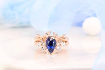 Pear shape Blue Sapphire Ring with Floral diamond Design