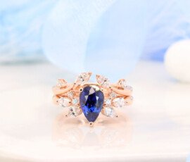 Pear shape Blue Sapphire Ring with Floral diamond Design