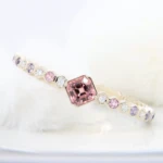 Honeycomb Jewellery Bee Bangle with Spinel Gemstone Honeycomb Jewellery - Custom Honeycomb Bangle Orange Pink Spinel with multi-coloured spinel and diamond - Custom Bee Honeycomb Bangle to bracelet