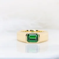Tsavorite signet ring in yellow gold, a green garnet emerald-cut stone bezel-set into a flat-top band, GIOIA bespoke jewellery Singapore